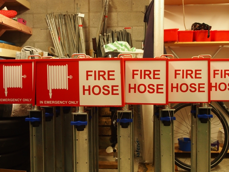 New fire hose reels mounted on a pier at Chaffers Marina
