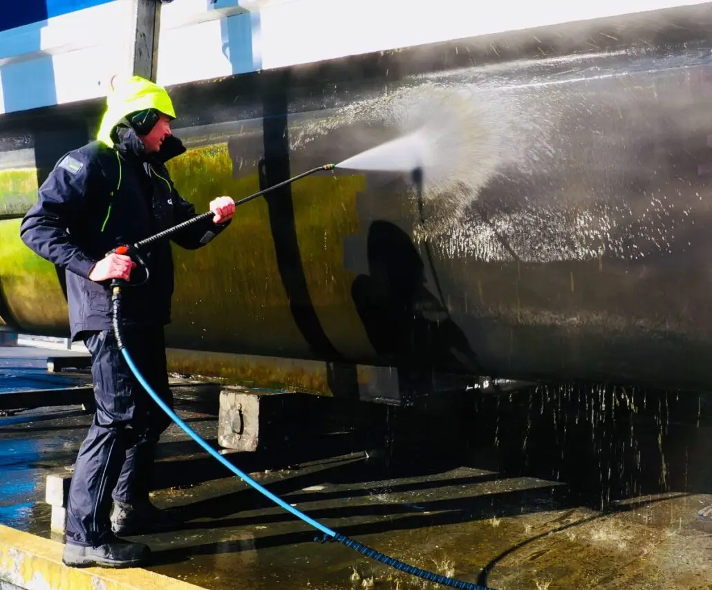 Water blasting a hull after haul-out at Chaffers Marina