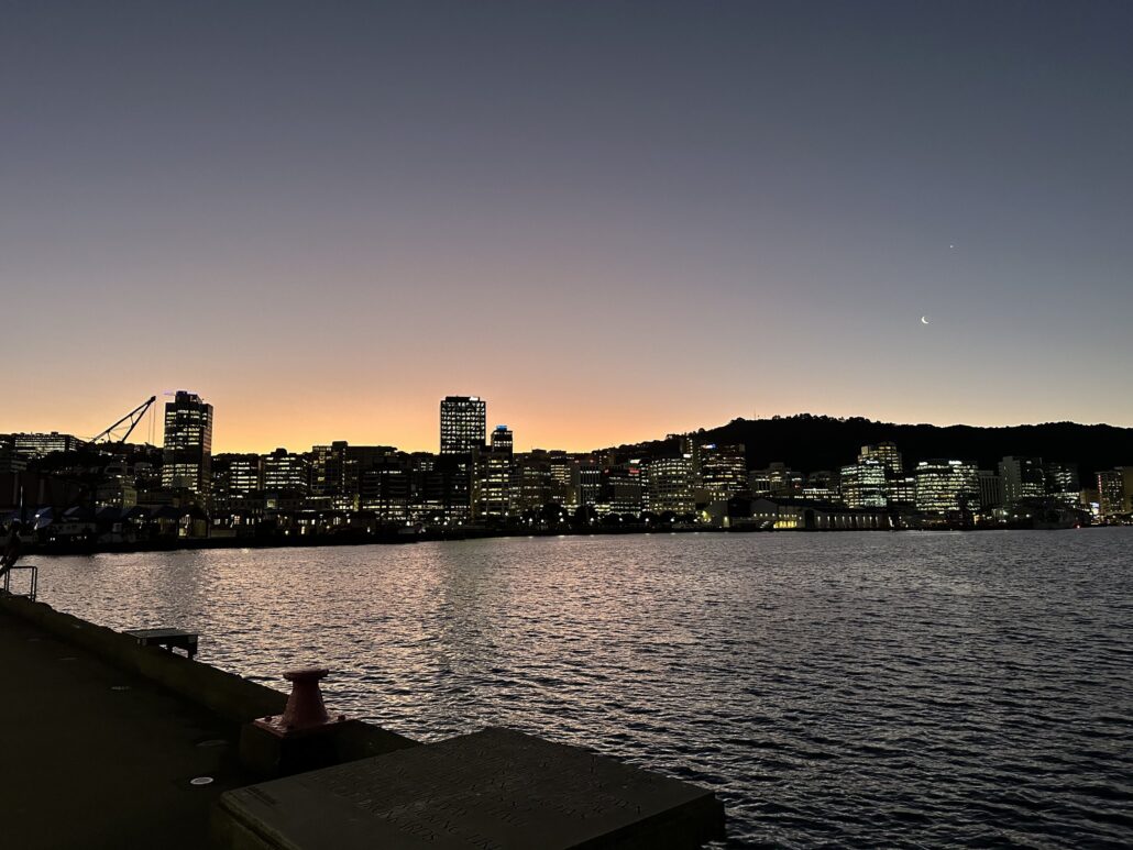 Wellington city lights at dusk, seen across the harbour from the waterfront