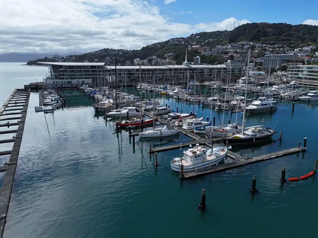 Aerial view of Chaffers Marina, its piers and the Clyde Quay Wharf apartments, with Mount Victoria behind